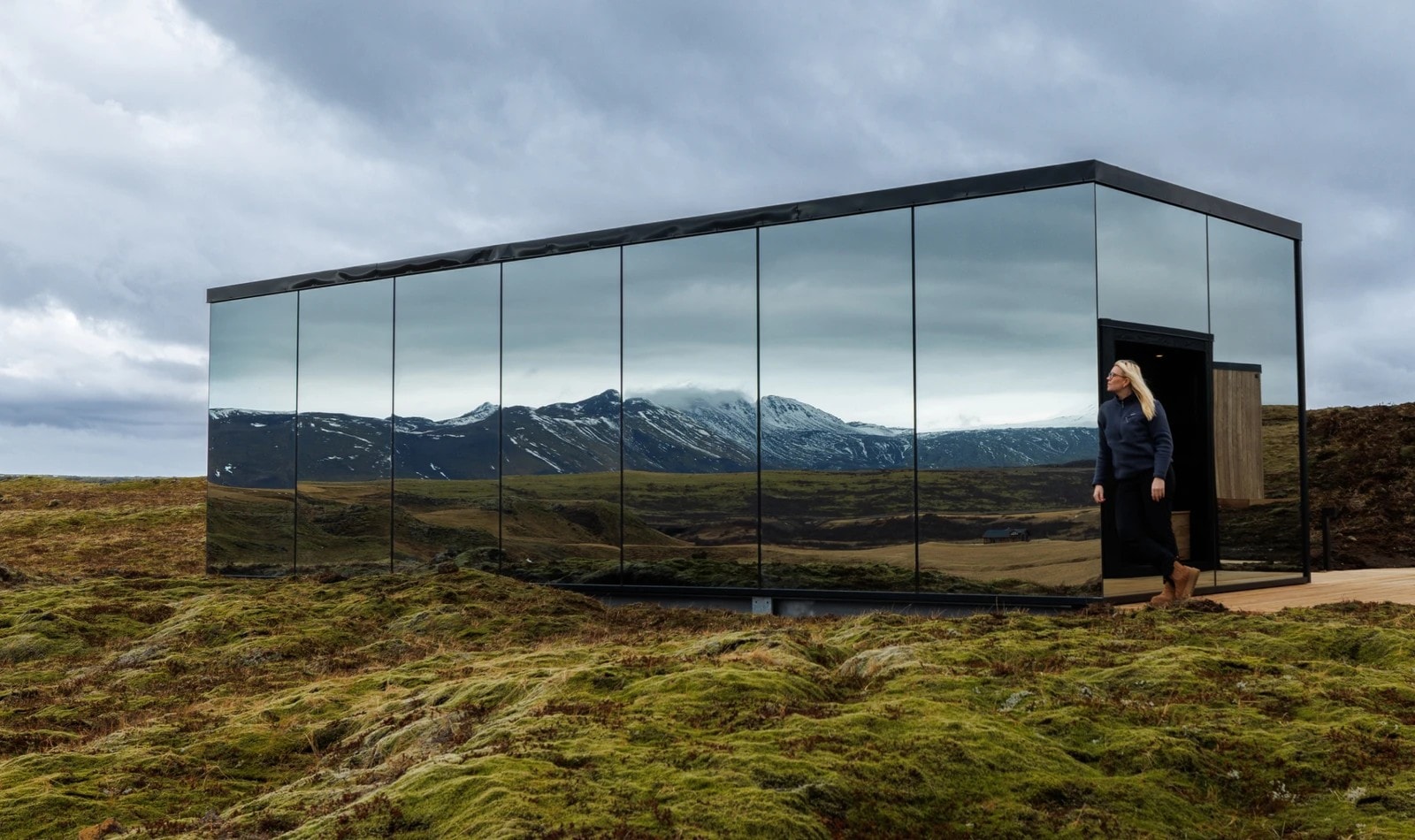 Cold plunge pool and sauna beside a pond